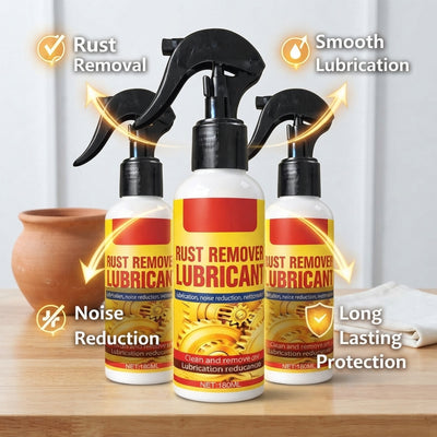 Three cans of rust remover lubricant spray arranged on a wooden surface with terracotta and white accent decor.